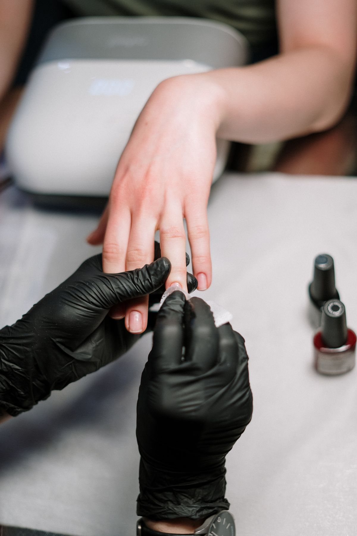 Gel manicure in progress at NailD By Nisha